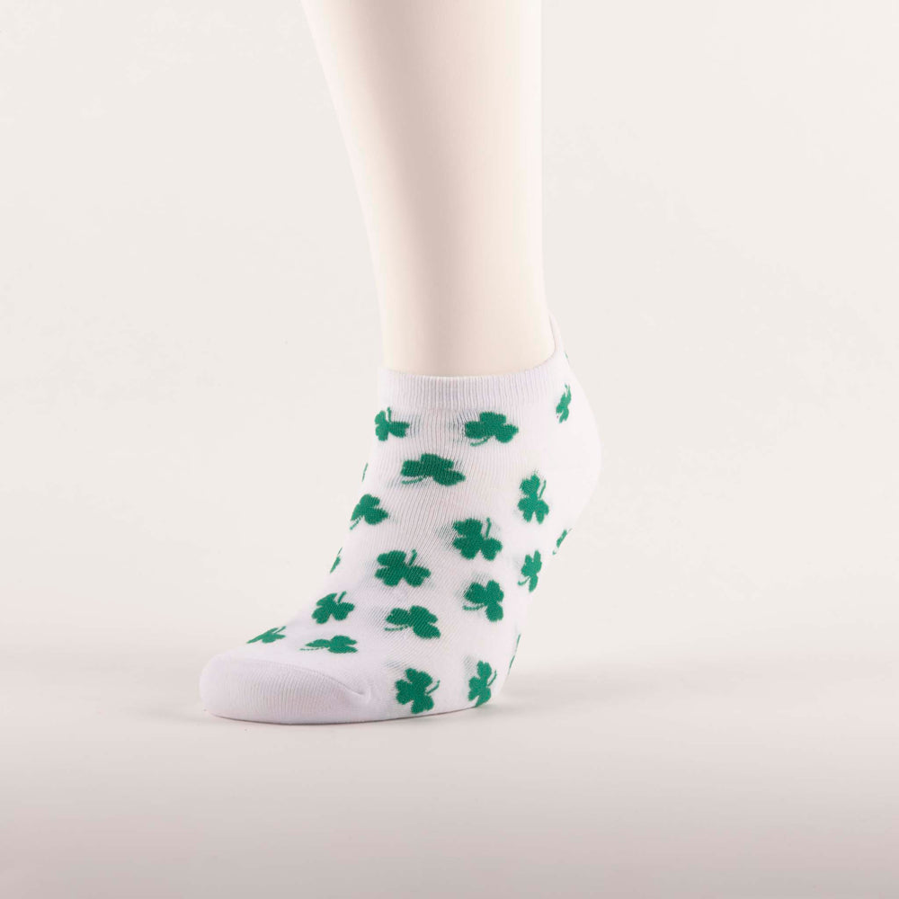 White socks with green shamrocks on foot